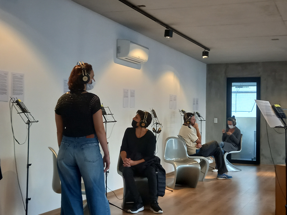 Visitors listening in the gallery