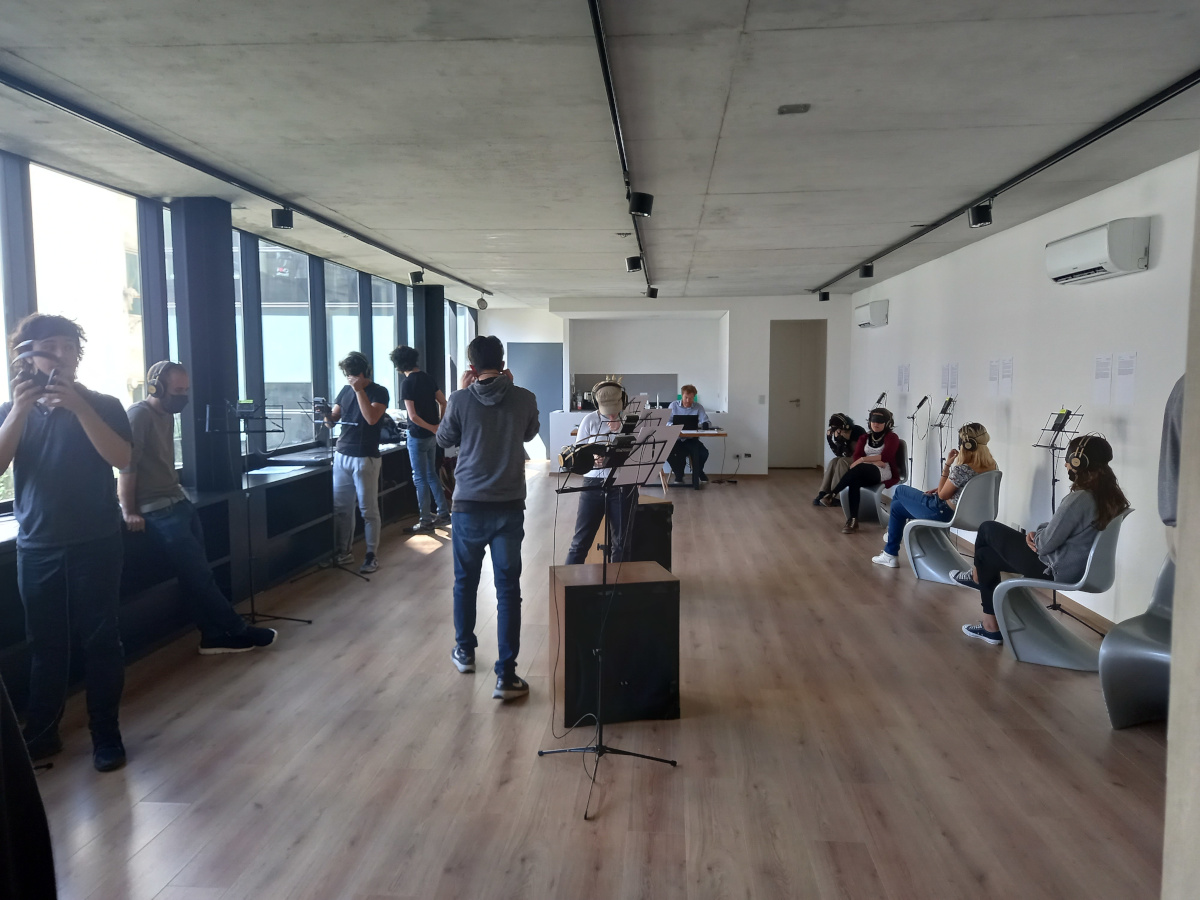 Visitors listening in the gallery