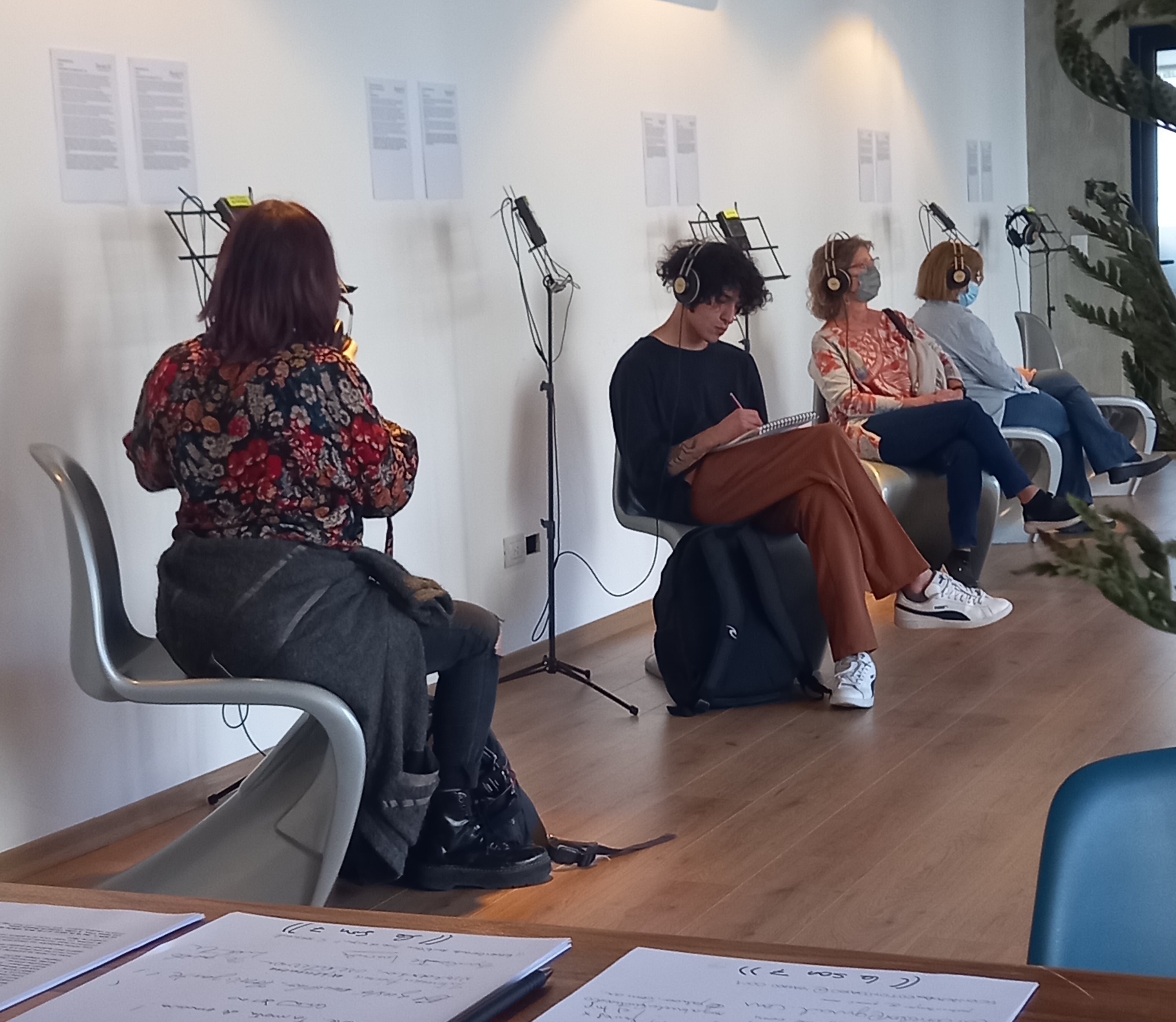 Visitors listening in the gallery